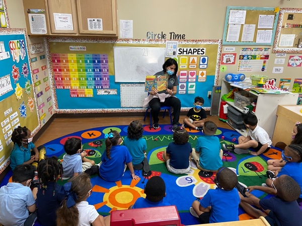 Ms. Milly During her morning circle time.